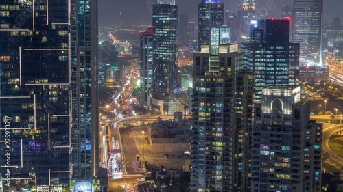 Wallpaper Mural Aerial top view of Dubai Marina night transition timelapse. Media city district on a background in Dubai, UAE. Illuminated modern towers and traffic on the road Torontodigital.ca