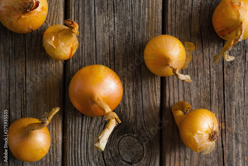 onions on weathered wooden table background