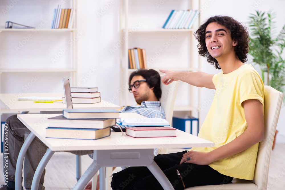 Two male students in the classroom Two male students in the classroom