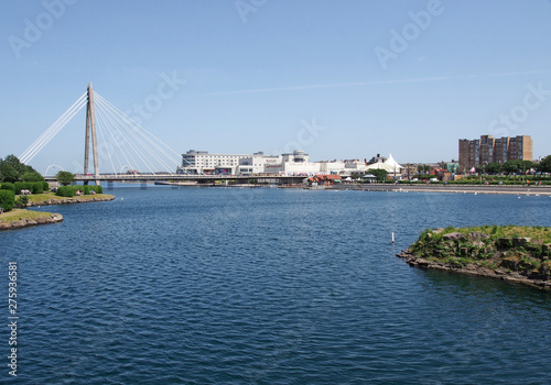 the suspension bridge and pier crossing the lake in southport merseyside with a view of the town hotels and buildings