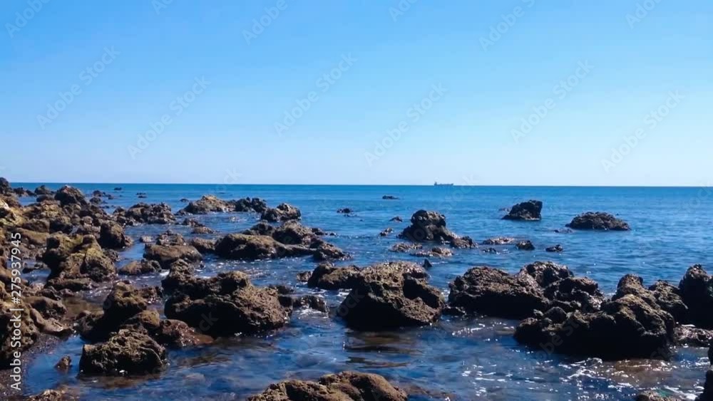 Natural Beauty Tropical Rocky Beach Scenery In The Clear Blue Sky On A Sunny Day At Umeanyar Village, North Bali, Indonesia Natural Beauty Tropical Rocky Beach Scenery In The Clear Blue Sky On A Sunny Day At Umeanyar Village, North Bali, Indonesia
