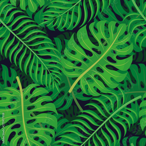 Seamless pattern with tropical leaves on a dark background.