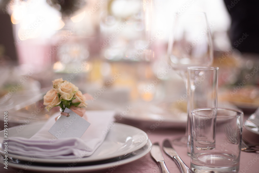 Fototapeta premium Wedding decorated table. Luxury light decor on table in restaurant