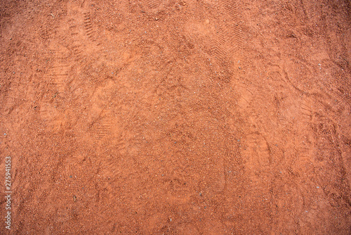 Red sand texture with shoe prints on top
