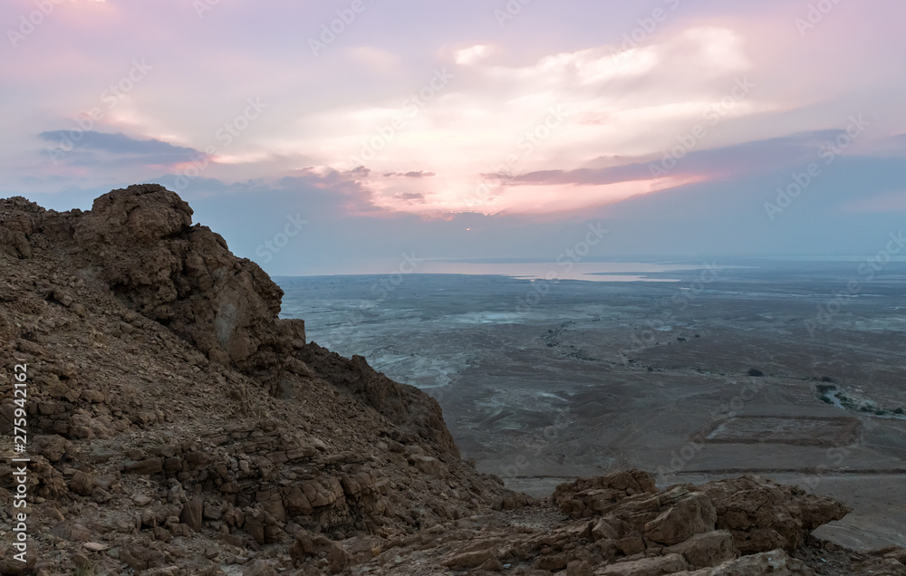 Sunrise view of the Dead Sea from the path leading up to the ruins of the fortress of Masada Sunrise view of the Dead Sea from the path leading up to the ruins of the fortress of Masada