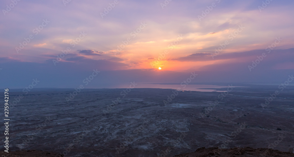 Sunrise view of the Dead Sea from the path leading up to the ruins of the fortress of Masada Sunrise view of the Dead Sea from the path leading up to the ruins of the fortress of Masada