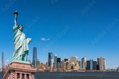 The Statue of Liberty over the Scene of New york cityscape river side which location is lower manhattan,Architecture and building with tourist concept © THANANIT