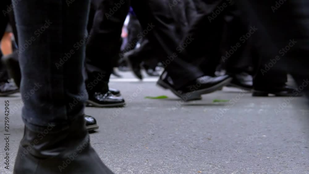 Legs of people walking and standing in line outside. Legs of people walking and standing in line outside.