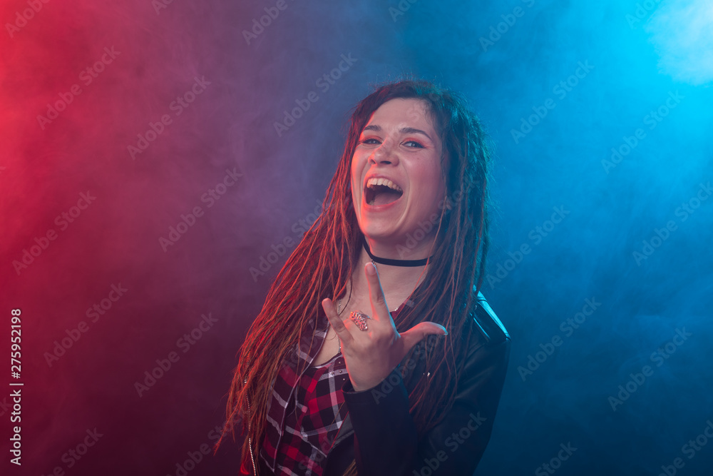 Style, youth, people concept - young woman with dreadlock looks like rocker