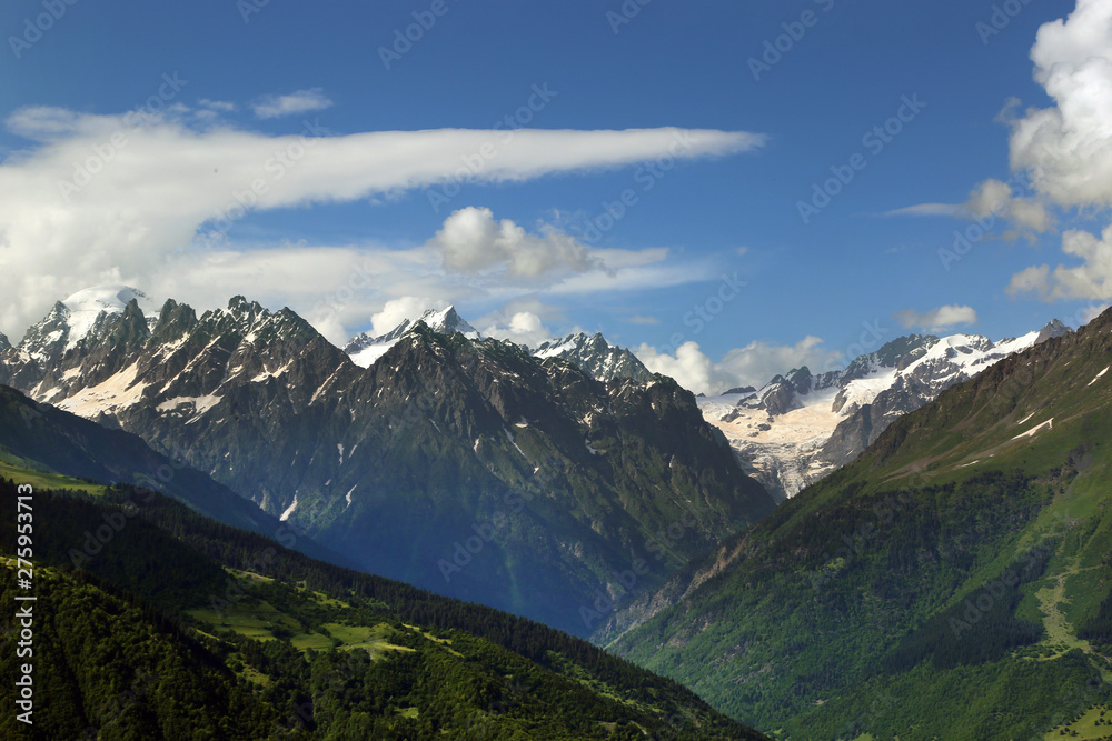 View of the snow-capped peaks of the Caucasian mountains in the Upper Svaneti region, Georgia.