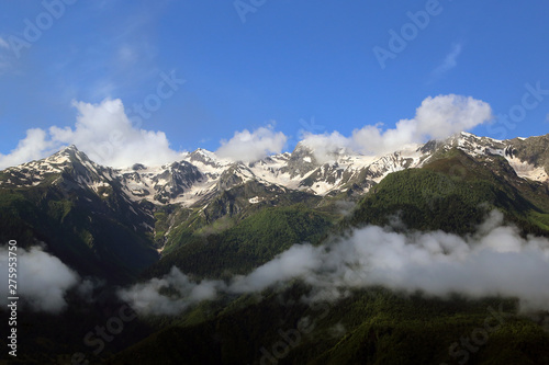 View of the snow-capped peaks of the Caucasian mountains in the Upper Svaneti region, Georgia.