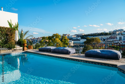 Swimming pool on roof top with beautiful city of Lisbon, Portugal