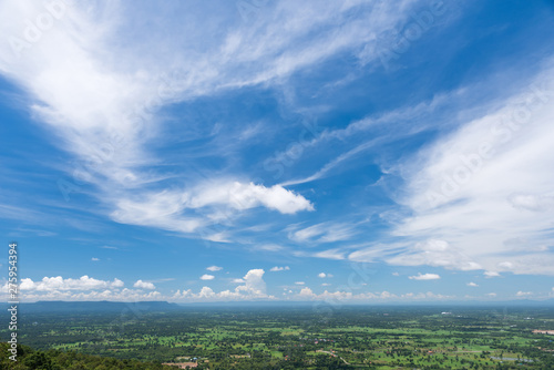 Beautiful fluffy clouds with green grass land
