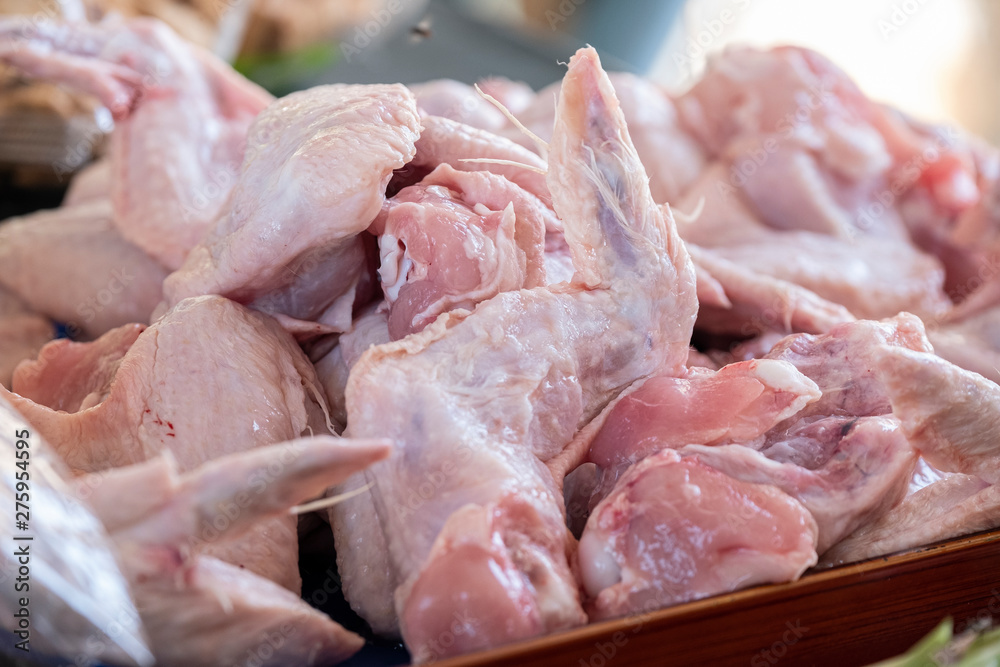 raw chicken pieces on a tray. chicken wings. healthy food. raw chicken pieces on a tray. chicken wings. healthy food.