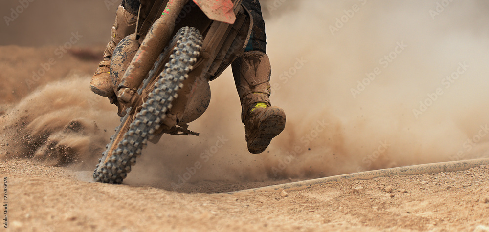 Motocross racer accelerating speed in track,driving in the motocross race
