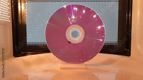 Science project: The death of a disk. The energy from microwave generated electricity in the coating of the CD  until the compact disk melts.