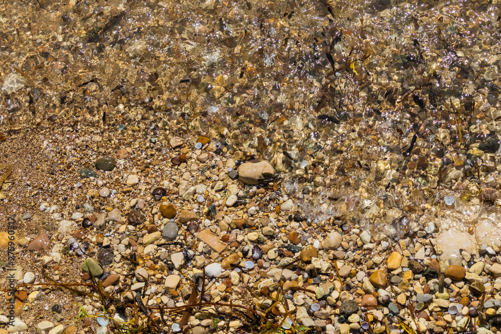 Lake colorful pebbles with the water closeup, pebbles background - Image Lake colorful pebbles with the water closeup, pebbles background - Image