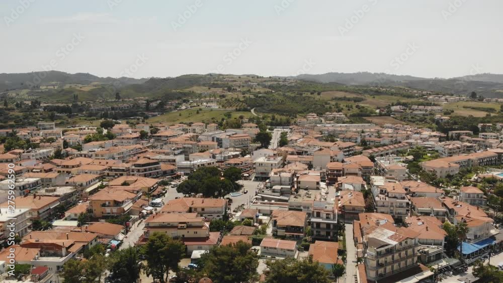 aerial drone view on the sea Town rooftops Chaniotis Chalkidiki Greece aerial drone view on the sea Town rooftops Chaniotis Chalkidiki Greece