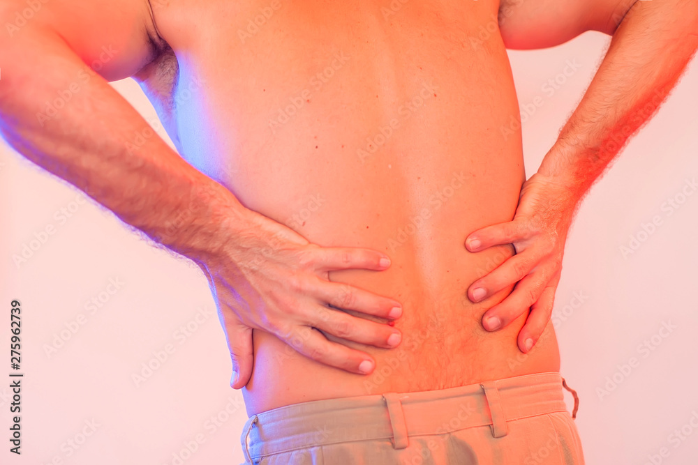 Man has a back pain. People, healthcare and medicine concept