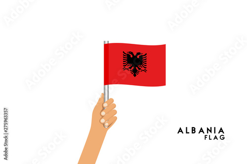 Vector cartoon illustration of human hands hold Albania flag. Isolated object on white background. © stocktr