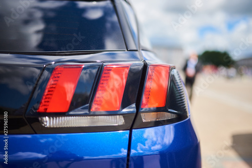 Картината върху платно Rear headlight, new blue car