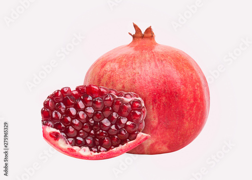 Purified pomegranate fruit. Juicy ripe pomegranate on a white background.