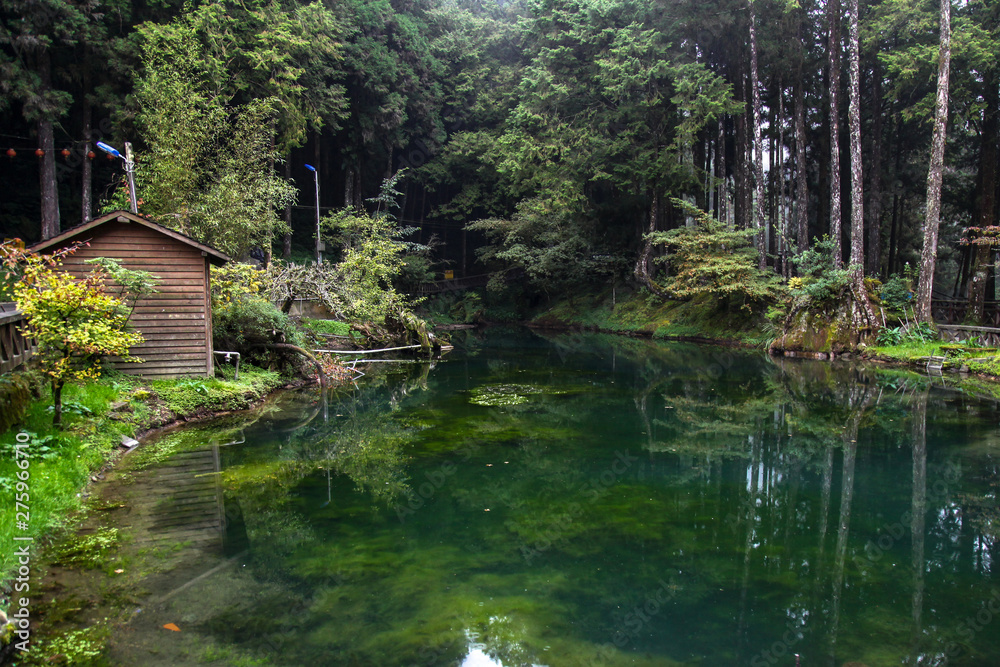 View of river and wood hut at Alishan national park area in Taiwan.