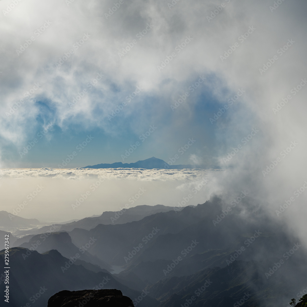 clouds over the mountains - view from gran canaria to teneriffa clouds over the mountains - view from gran canaria to teneriffa