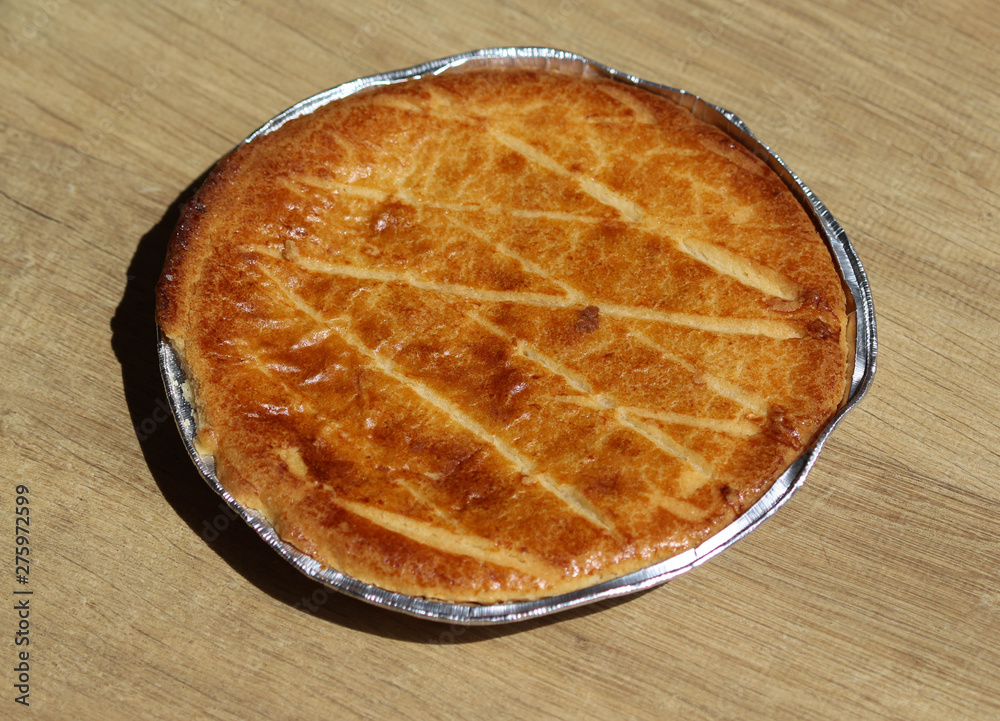 Selfmade Dutch Butter Cake (Boterkoek) cookie, fresh baked from the oven. Displayed on wooden background Selfmade Dutch Butter Cake (Boterkoek) cookie, fresh baked from the oven. Displayed on wooden background