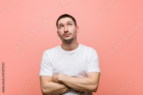 Photos Young casual man tired of a repetitive task.