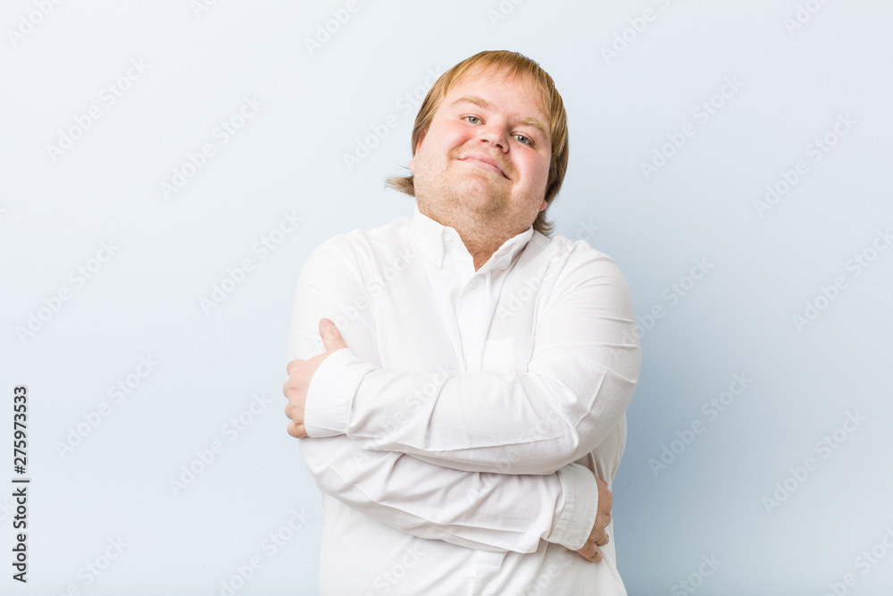 Young authentic redhead fat man hugs, smiling carefree and happy. Young authentic redhead fat man hugs, smiling carefree and happy.
