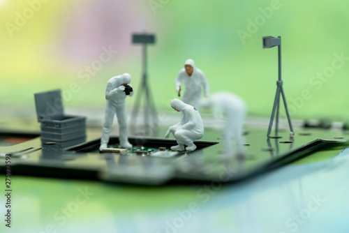 Miniature people searching for bugs on microchip. Vulnerability search and security system concept.
