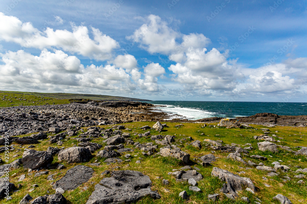 Beautiful view of the burren with limestone rocks with the sea in the background, Geoparks geoparks, Wild Atlantic Way, wonderful spring day in County Clare in Ireland