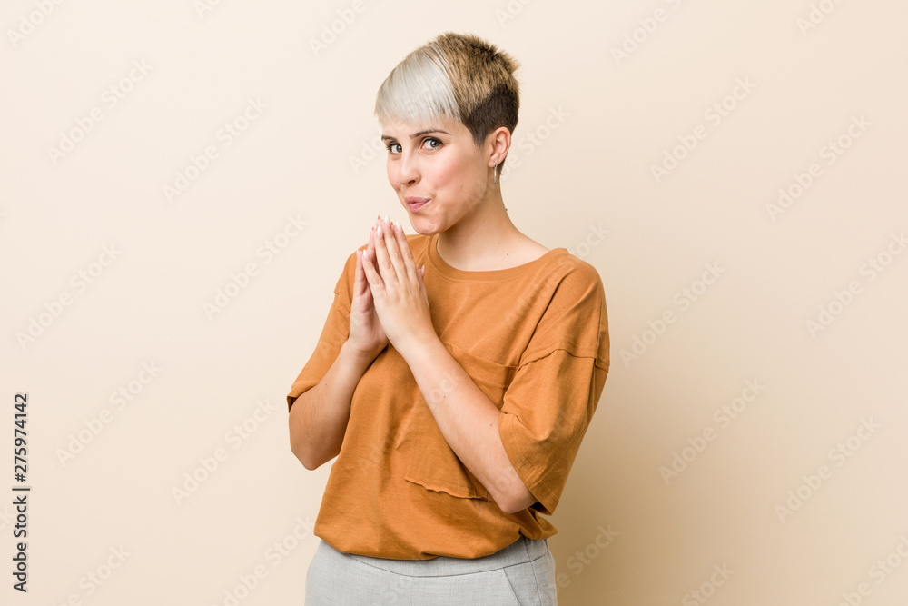 Young plus size woman with short hair making up plan in mind, setting up an idea. Young plus size woman with short hair making up plan in mind, setting up an idea.