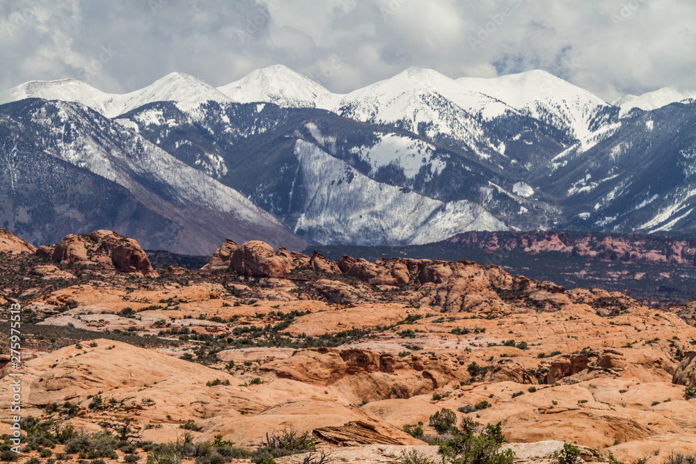 snowy mountains at the bottom of the desert, arches national park