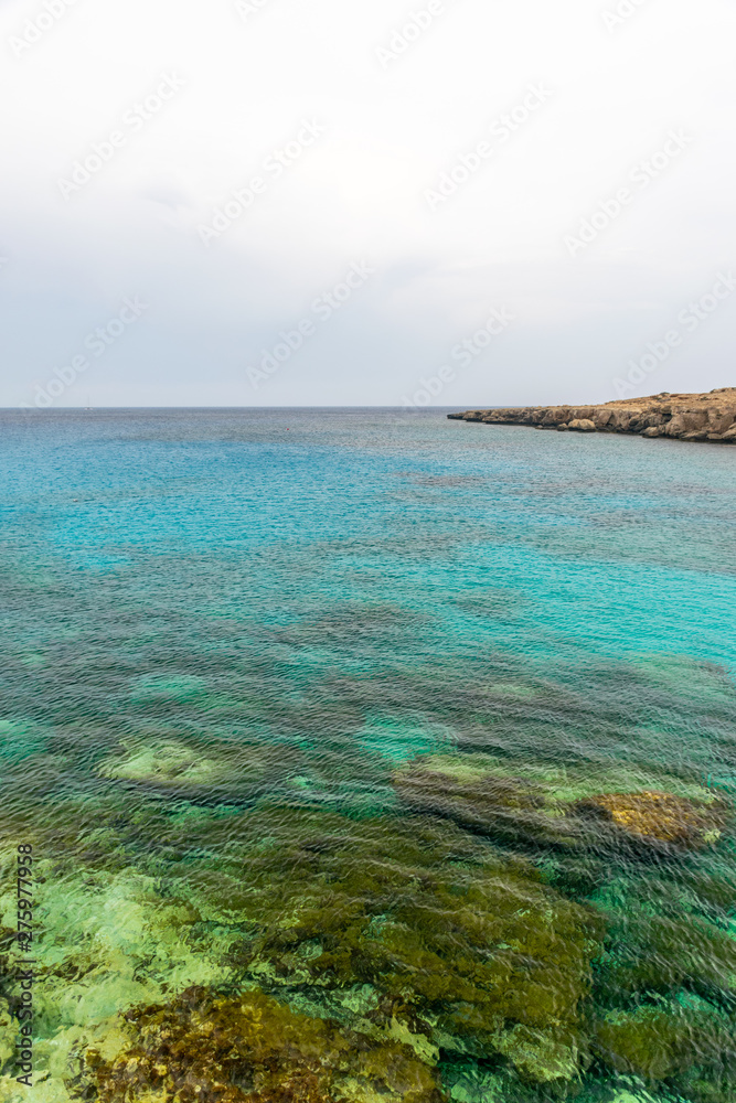 The picturesque blue lagoon on the coast of the calm sea.