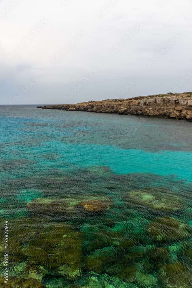 The picturesque blue lagoon on the coast of the calm sea.