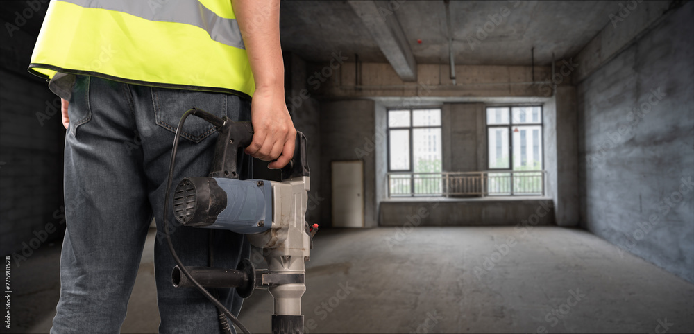 Construction Worker in front of construction site Construction Worker in front of construction site