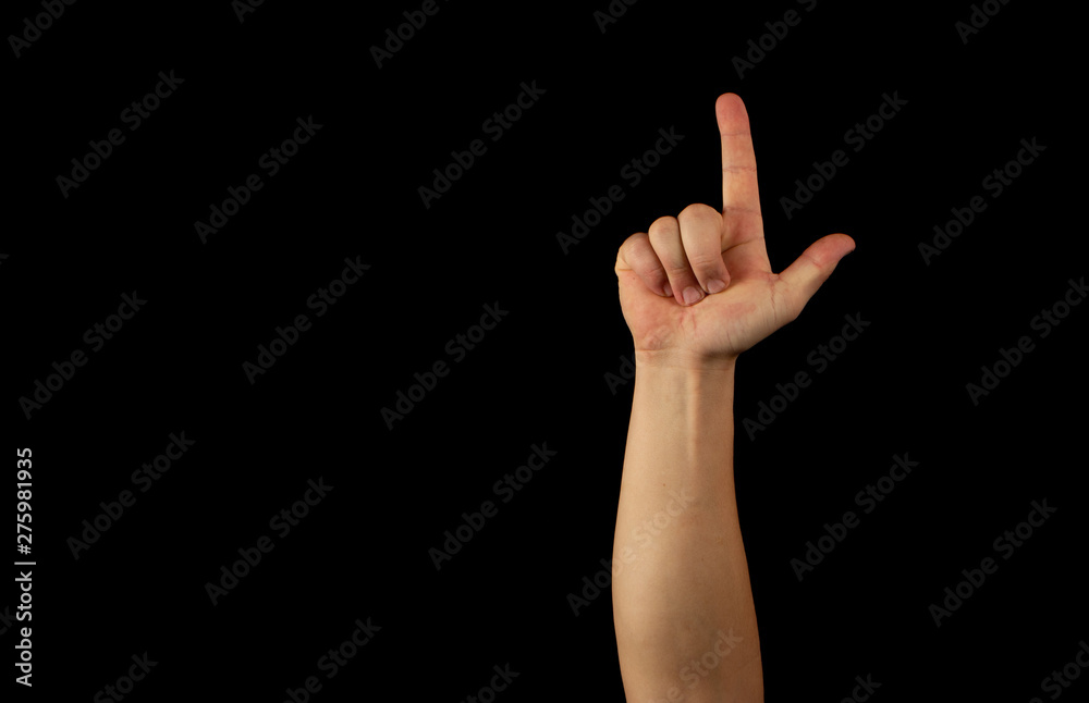 The hand of a young man on a black background The hand of a young man on a black background