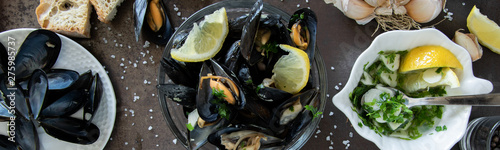Cooked delicious black mussel with toasted bread and tasty sauce. Healthy eating concept, rich protein food
