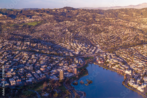 Aerial view of hilly city with lake at sunset - Lake Merritt, Oakland, California