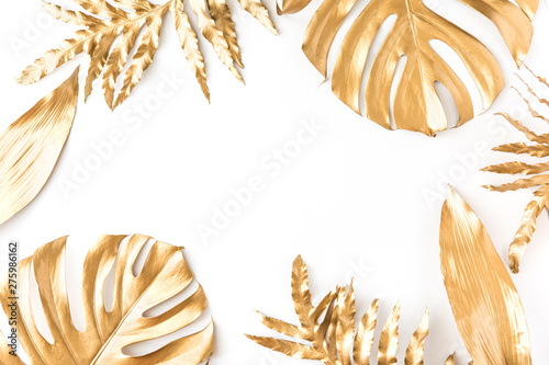Flat lay of golden tropical leaf design elements. Decoration elements for inv...