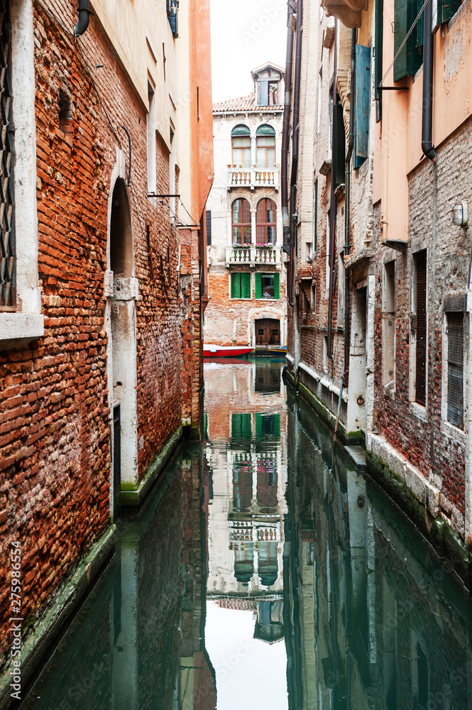 Scenic canal with old architecture in Venice, Italy. famous travel destination
