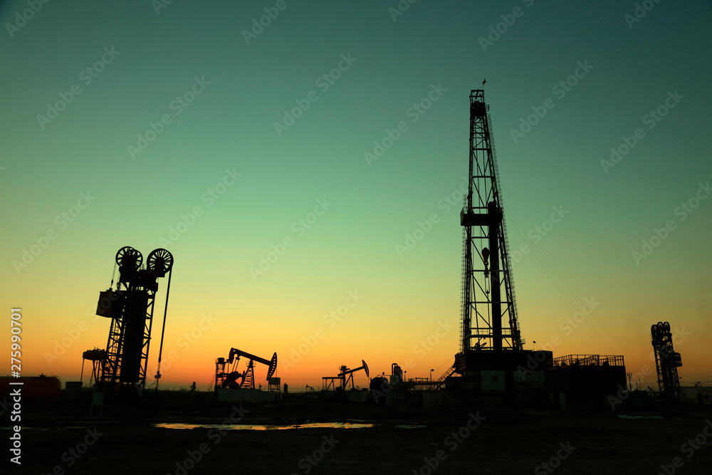 Oil drilling derrick in oilfield