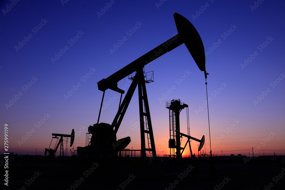 Beam balanced pumping unit under the setting sun Beam balanced pumping unit under the setting sun