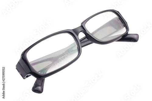 One transparent optical glasses in black plastic frame isolated on white background. Top view