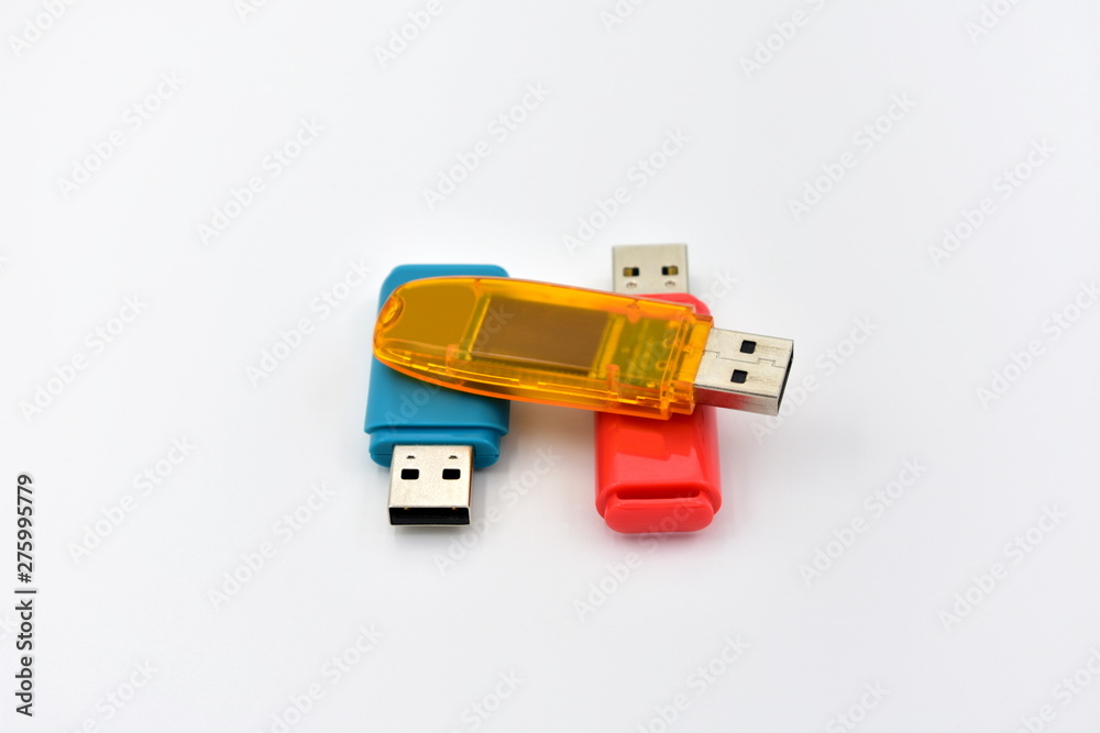 USB flash memory drives with colours on a white background. USB flash memory drives with colours on a white background.