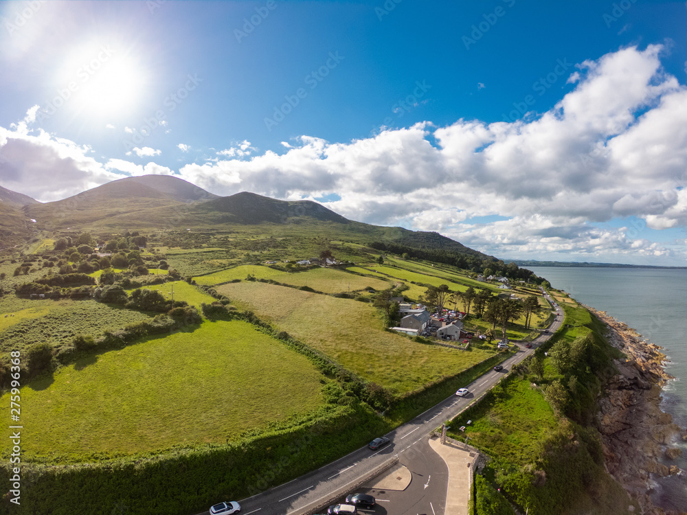 Mourne Mountains, Highest mountains in Northern Ireland. Aerial view of coast of sea and hills in summer time 