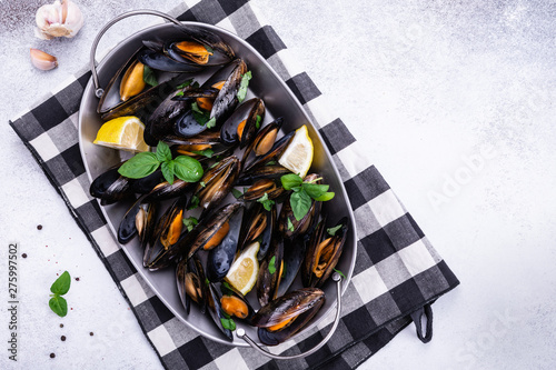 Seafood shell mussels with lemon and basil. Mussels clams in the shells. photo