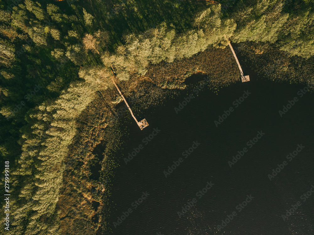aerial view of a smal wooden dock on a lake. aerial view of a smal wooden dock on a lake.